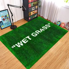 a green area rug with the words we're grass written in white on it