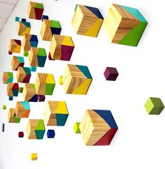 colorful wooden blocks are hanging on the wall