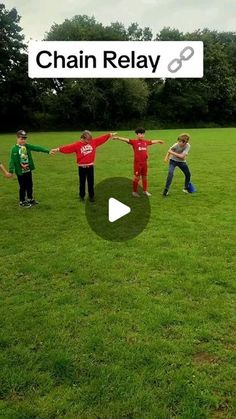 a group of young people standing on top of a lush green field next to each other