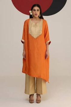 Rust orange asymmetric kaftan with a woven yoke with tassel details. Paired with a pant and inner. - Aza Fashions Straight Kurta With Back Tassel Tie-up For Eid, Eid Straight Kurta With Back Tassel Tie-up, Orange Bohemian Set For Eid, Bohemian Orange Sets For Eid, Bohemian Orange Set For Eid, Traditional Kurta With Back Tassel Tie-up For Diwali, Festive Bohemian Orange Kurta, Orange Bohemian Kurta For Diwali, Bohemian Orange Kurta For Diwali