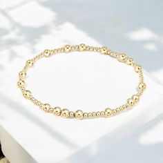 "Our beautiful Neola bracelet is made with 3mm and 4mm steel ball beads, plated with thick 18k gold. It will never tarnish! Our gold beaded bracelet measures 7 inches and will fit best on sizes small through XL." Gold Beaded Bracelets With Ball Chain, Gold Beaded Bracelets With Ball Chain For Everyday, Everyday Gold Ball Chain Beaded Bracelets, Everyday Gold Beaded Bracelets With Ball Chain, Gold Hypoallergenic Rosary Bracelet With Round Beads, Hypoallergenic Gold Rosary Bracelet With Round Beads, Gold Hypoallergenic Charm Bracelet With Round Beads, Gold Beaded Bracelet, Bracelet Size Chart