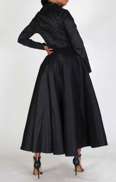 Solid long body jacket with V-neck closure Front button closures Long sleeves Cinched waist Full pleated skirt in a loose fit Polyester 95% Spandex 5% Trench Coat Style, Coat Style, Cinched Waist, Large Black, Nun Dress, Pleated Skirt, Black Friday, Trench Coat, Loose Fitting