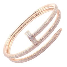 About This Piece: The Cartier Juste un Clou Nail Bangle is an exquisite bracelet crafted in 18k rose gold, adorned with sparkling diamonds. Shaped like a bent nail, it epitomizes bold elegance. This size 16 piece comes with papers, ensuring... Cartier Nail Bracelet, Rose Gold Nail, Cartier Juste Un Clou, Nail Bangle, Bracelet Cartier, Nail Bracelet, Nail It, Hermes Jewelry, Gold Nail