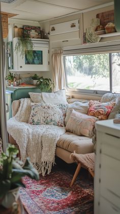 a living room filled with lots of furniture and decor on top of a carpeted floor