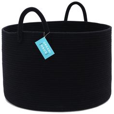 a black round basket with a blue tag on it