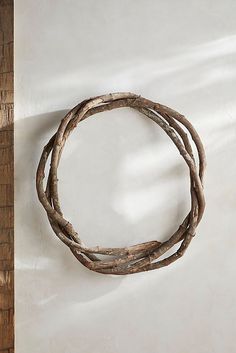 a round wooden object hanging on the wall