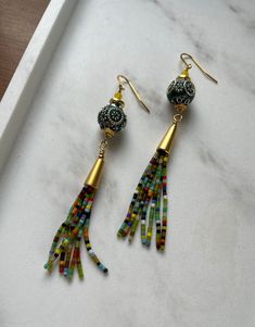 Gold Bohemian Tassel Earrings For Festive Occasions, Adjustable Gold Bohemian Tassel Earrings, Gold Tassel Earrings For Festivals, Multicolor Tassel Drop Earrings, Bohemian Gold Beaded Earrings With Colorful Beads, Bohemian Gold Beaded Earrings For Party, Bohemian Yellow Beaded Dangle Earrings, Yellow Bohemian Tassel Earrings, Bohemian Beaded Earrings With Gold Beads For Party