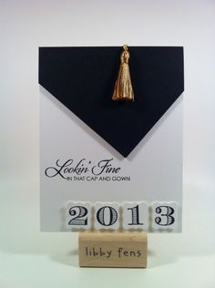 a black and white graduation card with a gold tassel on the front that reads, 2013