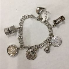 925 Sterling Silver Charm Bracelet W/ Columns, Wishing Well, And Sailboat Featured Charms: Wishing Well, "If You're Ever In Trouble, Here's The Price Of A Call, Dime Included", "Merry Christmas" W/Red And Green Gemstone, Mouse, Sagittarius Zodiac Charm, Column Ruins, Sailboat Excellent Condition Size: 7.00" Weight: 28.3 G Material: Sterling Silver Vintage Sterling Silver Charm Bracelet For Collectors, Themed Nickel-free Sterling Silver Charm Bracelet, Novelty Silver Hypoallergenic Charm Bracelet, Nickel-free Sterling Silver Symbolic Charm Bracelet, Nickel-free Silver Charm Bracelet For Collectors, Sagittarius Zodiac, Sterling Silver Charm Bracelet, Zodiac Sagittarius, Silver Charm Bracelet