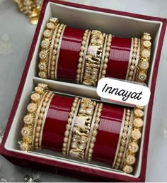 two red and gold bangles in a box