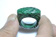 Buyer Will Receive 1 Piece Natural Malachite Full Carved Single Gemstone Made Ring.you will really love it.you will gift it to your love ones and friends. Product Details Product Name - Natural Malachite Full Carved Single Gemstone Made Ring. Gemstone - Natural Malachite Quantity - 1 Piece 100% Natural ----------------------------------------------------------------------------- THIS BEAUTIFUL ITEM IS AVAILABLE ONLY ON ETSY ------------------------------------------------------------------------ Green Malachite Rings With Polished Finish, Green Malachite Rings As A Gift, Green Carved Rings Perfect For Gifts, Green Malachite Rings For Anniversary, Green Carved Rings For Anniversary, Malachite Rings Gift, Malachite Rings As Gifts, Malachite Rings Suitable For Gifts, Green Carved Rings For Formal Occasions