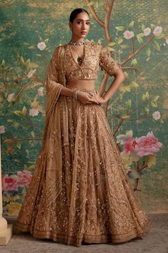 Gold organza lehenga with an attached cancan and floral, sequins, beads and thread embroidery. Comes with a net padded blouse and a dupatta. - Aza Fashions Net Lehenga Designs, Ridhi Mehra, Gold Lehenga, Net Blouse, Lehenga Dupatta, Organza Lehenga, Net Blouses, Embroidered Crop Tops, Net Lehenga