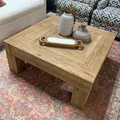 a living room with two couches and a coffee table in front of the couch