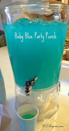 a baby blue party punch in a plastic cup