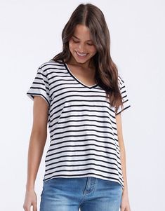 DESCRIPTION Add a touch of classic style to your wardrobe with the Turn Back Vee Neck T-Shirt in White/Black Stripe by White & Co. The Label. This timeless striped tee features a flattering V-neckline and a relaxed fit, perfect for everyday wear. The turn back cuffs add a chic detail that elevates the overall look, making it a versatile piece for any outfit. Whether you’re layering it under a jacket or wearing it on its own, this T-shirt promises both comfort and style. Pair this striped tee with blue jeans and white sneakers for a laid-back, casual look. For a more polished outfit, tuck it into a black midi skirt and add some bold accessories. This T-shirt is ideal for creating effortlessly stylish look for any occasion. Still browsing? Discover our full range of women's clothing. FEATURE Cotton V-neck Tops With Contrast Stripes, Cotton V-neck Top With Contrast Stripes, V-neck Tops With Contrast Stripes For Spring, White V-neck Top With Contrast Stripes, White V-neck Tops With Contrast Stripes, Striped Cotton V-neck T-shirt, Striped Relaxed Fit V-neck Tops, Black T-shirt With Contrast Stripes, Summer V-neck Top With Contrast Stripes