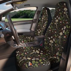 the interior of a car with floral seat covers on it's front and rear seats