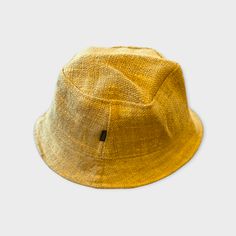 Eco-friendly Hemp Bucket or Wide Brim Sun Hat — Summer Beach Hat Hemp Bucket or Sun Hat - Yellow Golden Mustard Just in from Nepal! Get Ready for Summer... Perfect for summer...at the beach, pool, or just hanging around. Perfect for concerts and festivals too! Color options: Golden Sun Hat or Golden Bucket Hat Hemp sun hats are made from 100% hemp with a soft organic cotton lining, wire brim makes it easy to reshape. Great neutral colors for easy styling. Wide brim perfect to protect your head a Gold Flat Brim Sun Hat For Beach, Gold Straw Hat For Beach With Short Brim, Gold Short Brim Sun Hat For Beach, Gold Flat Brim Hat For The Beach, Gold Curved Brim Straw Hat For Summer, Eco-friendly Curved Brim Bucket Hat For Vacation, Gold Fedora Sun Hat For Summer, Gold Fedora Straw Hat For The Beach, Summer Gold Sun Hat With Short Brim