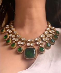 Introducing our exquisite Gold Finish Emerald Green Doublet Stones  Kundan Wedding Jewelry Necklace Set, inspired by the timeless elegance of Sabyasachi jewelry. Necklace length:15-16"  Adjustable length with a golden zari dori at the back  Necklace width-11" Pendant length and width 1"  This stunning set features meticulously crafted emerald green doublet stones, uncut moissanite, and intricate polki kundan work, all set in a luxurious gold finish. Perfect for a bride or anyone looking to make Green Necklace Set, Wedding Jewelry Necklace, Sabyasachi Jewelry, Unique Wedding Jewelry, Necklace Set With Earrings, Kundan Work, Gold Backdrop, Sabyasachi Jewellery, Polki Necklace