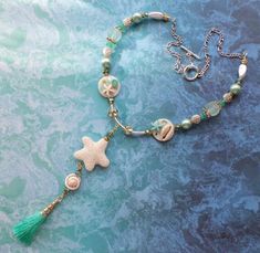 Celebrating beach vibes with this large and lovely one-of-a-kind necklace! Aqua Beads, Tarot Bags, Starfish Necklace, Micro Mosaic, Lava Bead, Beach Vibes, Vintage Button, Shell Beads, Gorgeous Necklaces