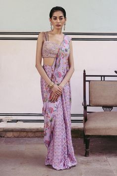 Lilac pre-draped saree with floral, leaf print in checkered pattern. Paired with aari, mirror, anchor thread, sequin embroidered bustier blouse.
Components: 2
Pattern: Printed, Embroidery
Type Of Work: Floral, aari, mirror, anchor thread, sequin
Neckline: Sweetheart neck
Sleeve Type: Sleeveless
Fabric: Dupion Silk, Lining: Crepe
Color: Purple
Other Details: 
Double strap on shoulder sleeve
Length:
Saree: 43 inches
Blouse: 13 inches 
Front Neck: 9.5 inches
Back Neck: 9.5 inches Bustier Blouse, Printed Sharara, Embroidered Bustier, Drape Saree, Kurta Designs Women, Dupion Silk, Sharara Set, Kurta Designs, Blouse Online