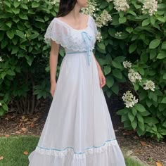 "1970s Gunne Sax wedding dress with floral embroidery and a scalloped edge. Tiered ruffle skirt with blue satin ribbon and lace trim. Can be worn on or off the shoulder. Fully lined, zips in the back. Size Estimate: Small Measurements Bust: 35\" / Waist: 26\" / Length: 51\" Condition Excellent, with a couple very faint marks at hem when closely inspected. Follow @willavintage on Instagram --------------------------------------------------------------------------------------- All items are vintag Vintage Ruffled Dresses For Wedding Night, Gunne Sax Wedding Dress, Confirmation Dresses, Dress With Floral Embroidery, Sax Dress, Gunne Sax Dress, Tiered Ruffle Skirt, Etsy Wedding Dress, Mode Chic