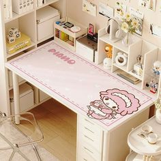 a desk with a hello kitty rug on it