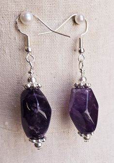 Faceted teardrop amethyst stone beads are strung with silver beads and spacer discs and hung on silver ear wires.   Earrings are strung on 925 silver ear wires and measure over 1 inch long. Handmade Amethyst Teardrop Crystal Earrings, Amethyst Gemstone Crystal Drop Earrings, Purple Amethyst Teardrop Crystal Earrings, Amethyst Crystal Earrings For Jewelry Making, Amethyst Gemstone Teardrop Dangle Earrings, Amethyst Gemstone Crystal Earrings For Jewelry Making, Teardrop Purple Earrings With Natural Stones, Purple Teardrop Earrings With Natural Stones, Amethyst Gemstones For Jewelry Making In Teardrop Shape