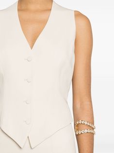 Chic V-neck Evening Vest, Elegant V-neck Evening Vest, Elegant V-neck Vest For Formal Occasions, Elegant V-neck Vest With Buttons, Fitted Sleeveless Vest With Hidden Button Closure, Elegant V-neck Spring Vest, Tailored Chic Vest With Buttons, Chic Tailored Vest With Buttons, Elegant Formal Vest With Buttons