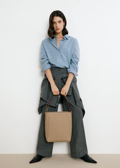 The Carrie Medium Tote Bag's rectangular silhouette sits perfectly on the shoulder, with a wide leather strap that is adjustable with the belt loop detail. Lined with smooth leather, the bag can fit an 13" laptop, making it an ideal everyday tote. Optional Add-ons: Webbing Shoulder Strap; AirPods Pro Case. Luxury Bucket Bag With Top Carry Handle For Business, Luxury Business Bucket Bag With Top Carry Handle, Versatile Formal Tote Box Bag, Versatile Tote Box Bag For Formal Occasions, Versatile Laptop Bag With Removable Pouch For Work, Modern Laptop Bag With Removable Pouch For Work, Timeless Bucket Shoulder Bag For Office, Timeless Shoulder Bag With Removable Pouch For Office, Versatile Formal Tote Shoulder Bag