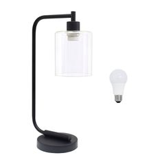 a black table lamp with a white light bulb on the side and a black base