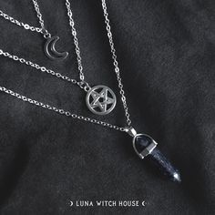 This most beautiful set of 3 silver coloured necklaces make a great witchy trio accessory.  This set is made of 3 single necklaces (they are not attached) so you can wear all together or individually.  - Material Type: Alloy & Natural Stone - Moon Necklace Length: 7.8 inches - Pentagram Necklace Length: 9 inches - Crystal Necklace Length: 11 inches All necklaces are inside a material pouch and then carefully placed inside an envelope lined with bubble wrap to ensure no damage in transit. *Please Enchanting Silver Necklace, Magical Silver Pendant Necklace, Witchy Metal Necklaces For Gift, Mystical Silver Star Jewelry, Mystical Silver Star-shaped Jewelry, Handmade Silver Layered Necklace Gift, Handmade Silver Layered Necklace For Gift, Silver Pendant Charm Necklace With Magical Style, Magical Silver Pendant Crystal Necklace