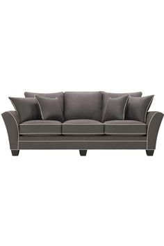 a gray couch with pillows on it