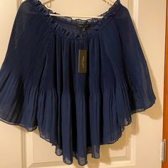 Cute Peasant Style Top In Navy Blue. Has Flared Sleeves With Elastic Neckline For Off The Shoulder. Never Worn With Tags. Size Medium. Blue Pleated Summer Tops, Blue Pleated Tops For Summer, Chic Blue Billowy Tops, Chic Billowy Blue Tops, Billowy Blue Summer Top, Billowy Blue Top For Summer, Summer Billowy Blue Top, Elegant Summer Blouse With Crinkle Texture, Bohemian Crinkle Texture Tops For Summer