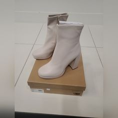 New In Box White Synthetic High Heel Boots, White Synthetic High Heeled Boots, White Medium Width Closed Toe Heeled Boots, White Closed Toe Boots With Stacked Heel, White Platform Heeled Boots With Pointed Toe, White Heeled Boots With Round Toe Medium Width, White Heeled Boots With Sculpted Heel And Medium Width, White Heeled Boots With Padded Heel, Medium Width, White Heeled Boots With Padded Heel