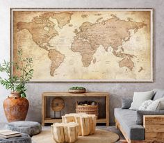 a living room filled with furniture and a large world map on the wall above it