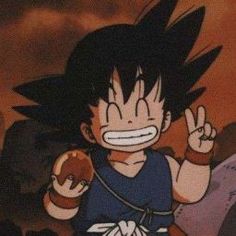 a young gohan holding an apple in one hand and making the peace sign with his other