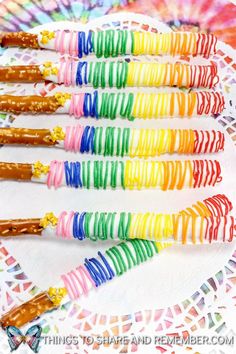 colorful candy sticks are arranged on a plate