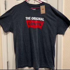 Levi’s: The Original Levi’s T-Shirt. 50% Cotton - 50% Polyester. Size Xl Levi's Relaxed Fit Short Sleeve T-shirt, Levi's Casual Short Sleeve Shirt, Levi's Graphic Tee With Crew Neck, Levi's Graphic Tee Crew Neck Top, Levi's Short Sleeve T-shirt For Summer, Levi's Summer Short Sleeve T-shirt, Levi's Casual Top With Graphic Print, Levi's Casual Tops With Graphic Print, Levi's Cotton Short Sleeve Top