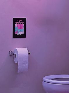 a bathroom with a toilet and a poster on the wall above it that says time stood up