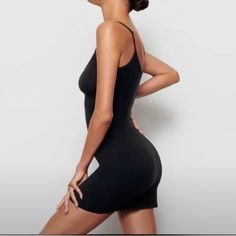 Skims Fits Everybody Slip Dress Size: M Color: Onyx New With Tags A Buttery Soft Mini Dress That Hugs Your Curves. Form-Fitting And Lightweight, This Style Is Perfect To Wear Under Other Dresses As Second-Skin Lining. Black Bodycon Mini Dress With Built-in Bra, Spring Seamless Black Bodycon Dress, Workout Mini Dress With Built-in Bra, Black Seamless Mini Dress, Black Seamless Chic Dress, Black Seamless Mini Bodycon Dress, Sleeveless Seamless Black Dress, Seamless Sleeveless Black Dress, Sleeveless Black Seamless Dress