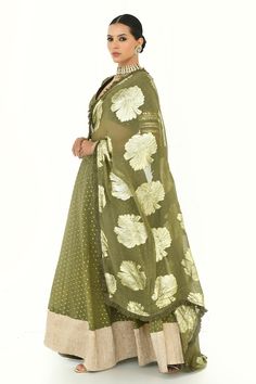 Olive green lehenga with golden petite patterns. Comes with sequin embroidered blouse and floral woven pattern frill bordered dupatta. - Aza Fashions Festive Green Lehenga With Sheer Dupatta, Green Lehenga With Cutdana And Kundan, Green Dola Silk Dupatta For Reception, Green Chanderi Lehenga With Zari Work, Designer Green Lehenga With Traditional Drape, Designer Green Lehenga With Sheer Dupatta, Green Lehenga With Traditional Drape For Designer Wear, Floor-length Gold Palazzo Set With Dupatta, Semi-stitched Kundan Dress In Pista Green