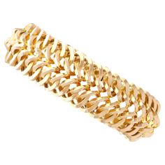 An exceptional, fine and impressive vintage French 18 karat yellow gold bracelet; part of our diverse vintage French jewellery collections. This exceptional, fine and impressive vintage gold bracelet has been crafted in 18k yellow gold. The substantial multi-dimensional articulated bracelet consists of interlacing curvilinear links, conjoined within a repeating chevron pattern; this well-made design has been crafted in a pleasing tactile manner. This 1960s gold bracelet secures to the reverse wi Luxury Antique Yellow Gold Chain Bracelet, Vintage Gold Bracelet, Vintage Gold Earrings, French Jewelry, Antique Coins, Yellow Gold Bracelet, Coin Pendant, Chevron Pattern, Vintage Bracelets