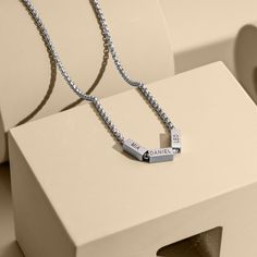 This classic stainless steel necklace for dad is the perfect way to keep your loved ones close to his heart. The custom rectangle beads can be personalized with your kids' names, making it a truly meaningful gift. Each bead is carefully hand-stamped with precision and care, creating a unique and sentimental piece that dad will cherish for years to come. This necklace is a timeless and stylish accessory that is sure to make a thoughtful and memorable gift for any occasion. Whether it's a gift for Dad With Kids, Necklace With Kids Names, Family Jewelry, Father Gift, Family Jewellery, Kids Names, Steel Necklace, Stainless Steel Necklace, Memorable Gifts