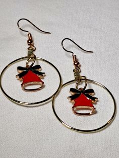 Dangle Hoop Red Bell Earrings are just shy of 2.25 inches long. These charming earrings are perfect for Christmas, parties, date nights, or for whatever you can imagine. The French wire on these earrings is hypoallergenic.  Please be aware that the French wire that goes in your ear is a slightly different color gold than the gold hoop it's attached to. If that is an issue for you, please do not purchase these earrings. Nickel-free Hoop Earrings For Festive Occasions, Festive Nickel-free Dangle Hoop Earrings, Nickel-free Dangle Hoop Earrings For Festive Occasions, Festive Nickel-free Hoop Earrings, Nickel-free Hoop Earrings For Festivals, Hoop Earrings For Valentine's Day Party, Valentine's Day Hoop Earrings For Party, Holiday Red Ear Wire Earrings, Red Holiday Earrings With Ear Wire