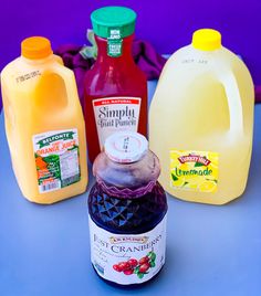 several different types of juice on a table