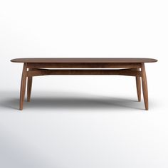 a wooden table sitting on top of a white floor