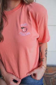 My absolute favorite tee! This 'just peachy ' tee is embroidered on a Comfort Colors short sleeve unisex tee.  Please wash on gentle cycle and dry on low.  If you are wanting a different design, wording, or a different clothing style, please send me a message so we can discuss the details. Please include thread color at checkout If you need this order rushed, please add these to your cart: https://www.etsy.com/listing/1043569716/rush-my-order-for-t-shirts?ref=shop_home_active_19&frs=1 Rush my order + Priority shipping, click here: https://www.etsy.com/listing/1043567696/rush-my-order-priority-shipping-for-t?ref=shop_home_active_35&frs=1 Pink T-shirt With Embroidered Text For Summer, Pink Embroidered T-shirt For Summer, Cute Peach T-shirt With Crew Neck, Trendy Peach Short Sleeve T-shirt, Summer T-shirt With Letter Embroidery And Short Sleeves, Summer Short Sleeve T-shirt With Letter Embroidery, Trendy Short Sleeve T-shirt With Letter Embroidery, Spring Pink T-shirt With Custom Embroidery, Trendy Relaxed Fit Peach T-shirt