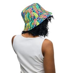 Inspired by the vibrant beauty of Hawaiian tropical foliage, our Hawaiian Tropical Leaves Bucket Hat brings the essence of the islands right to your wardrobe. Crafted with care and attention to detail, this hat captures the spirit of aloha and invites you to embrace the laid-back tropical vibe. This reversible bucket hat can be worn on both sides, making it easy to match with different outfits. Made of breathable premium fabric, this hat will become your go-to streetwear accessory. • Made to ord Adjustable Bucket Hat For Vacation, Tropical Multicolor Spring Hats, Multicolor Tropical Hats For Summer, Multicolor Tropical Summer Hats, Multicolor Reversible Summer Sun Hat, Summer Multicolor Flat Brim Bucket Hat, Multicolor Flat Brim Summer Bucket Hat, Green Reversible Beach Hat, Reversible Green Beach Hat