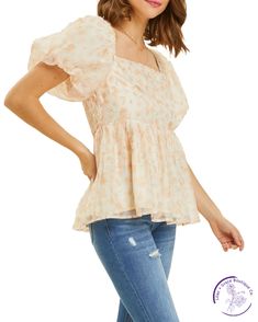 Indulge in romance with our floral puff-sleeved blouse. The square neck and smocked back add a flirty touch to this babydoll top. Perfect for date night or a day out with friends, it's the ideal combination of sweet and stylish. Material: 100% Polyester Spring Square Neck Flowy Smocked Top, Flowy Square Neck Smocked Top For Spring, Flowy Smocked Top With Square Neck For Spring, Square Neck Puff Sleeve Top With Ruffles For Brunch, Flowy Puff Sleeve Blouse With Smocked Bodice, Flowy Blouse With Smocked Bodice And Puff Sleeves, Chic Square Neck Puff Sleeve Top With Smocked Back, Chic Floral Print Balloon Sleeve Puff Top, Feminine Spring Puff Sleeve Top With Square Neck