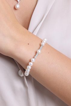 MATERIAL SPECIFICATIONS Metal : 14K Gold Gemstone: Pearl and Zircon Pearl Color: White Pearl Quality: AA Pearl Grain Size: 7 mm  Pearl Grain Shape: Round Bracelet Lengt: 18-19-20-21-23 cm Stock Code: Z098467 THE WEIGHT OF OUR PRODUCTS MAY VARY + - 5% GR The products will be securely shipped in special gift boxes, free of charge. Our handmade jewelry is crafted by our experienced team of jewelry makers with an eye for detail and perfection.  FOR OUR OTHER PRODUCTS PLEASE CHECK OUT: https://www.et Classic White Gold Diamond Pearl Bracelet, Classic Diamond Pearl Bracelet For Formal Occasions, Elegant White Gold Pearl Bracelet With Diamonds, Elegant Pearl Bracelet With Diamond Accents, White Diamond Bracelet With Diamond Accents As A Gift, Silver Pearl Bracelet For Anniversary, Fine Jewelry, Fine Jewelry Diamond Pearl Bracelet For Anniversary, Fine Jewelry Silver Pearl Bracelet For Anniversary, Classic Cubic Zirconia Crystal Bracelet For Wedding